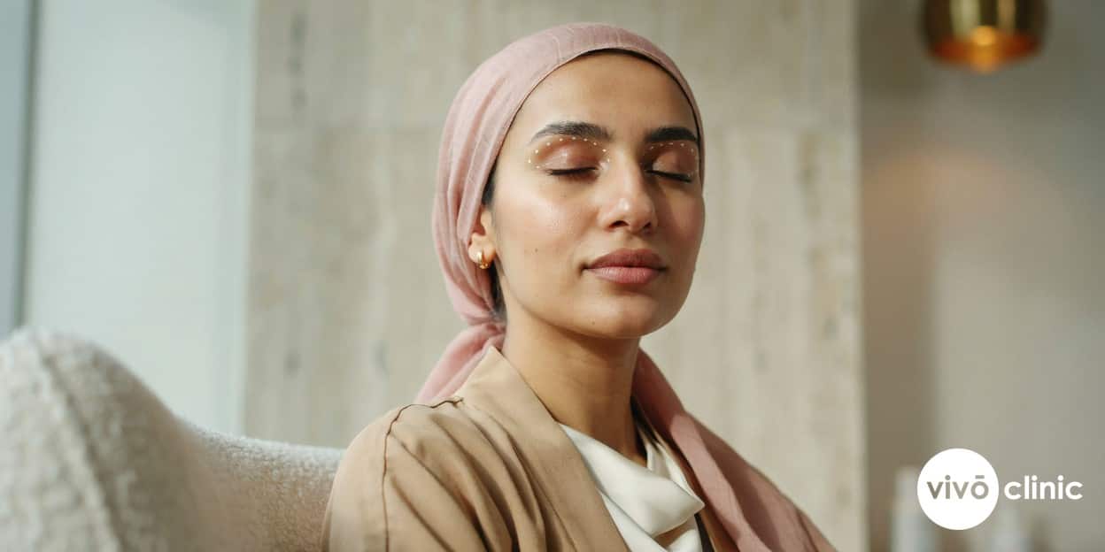 Middle Eastern woman with fine white cosmetic marking dots mapped across her upper eyelid during a plasma eye lift consultation for hooded eyelids at VIVO Clinic Dubai