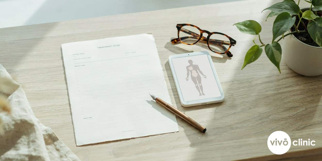 Photorealistic editorial still life of a premium aesthetic clinic consultation desk with an itemised treatment plan, a tablet showing a body diagram and a price breakdown, soft natural light